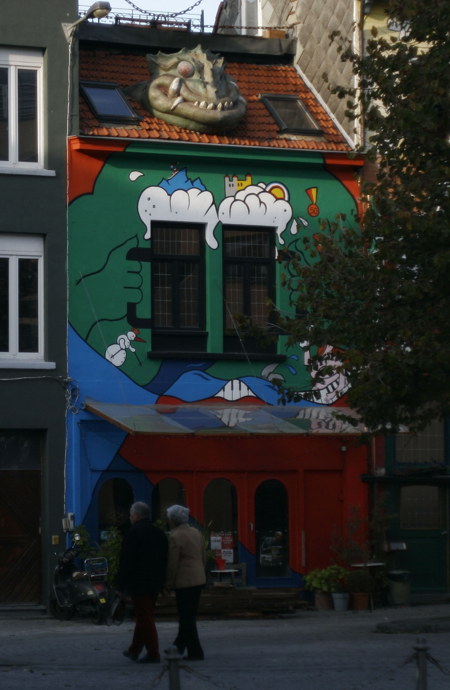 Myself with a guitar, sitting on a chair.